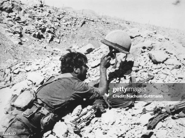 An Israeli soldier under sniper attack in the Golan Heights.