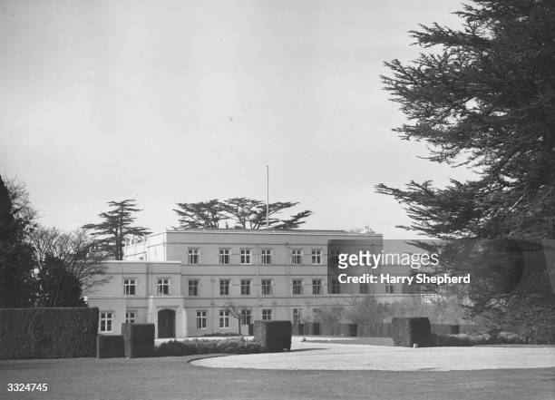 The Royal Lodge in the Great Park, at Windsor, Bucks, where King George VI retires to throw off the worries of State and live the life of a country...