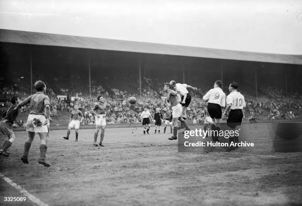 Players vie for the ball during the Great Britain v Yugoslav semi-final football match at Wembley Stadium. Olympic Photo Association Photo