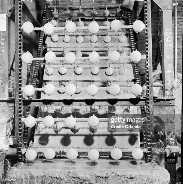 Official baseballs being manufactured at the Spalding and Company plant, Chicopee, Massachusetts.