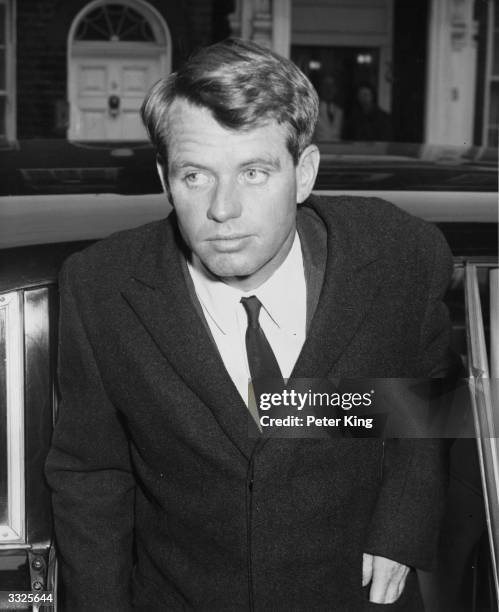 Robert Kennedy , the Attorney General of the United States arriving at the home of Princess Lee Radziwill, sister of Jackie Kennedy.