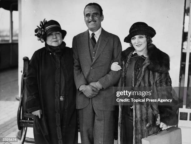 American actor Douglas Fairbanks Senior with his wife Mary Pickford and her mother on board the 'Olympic'.