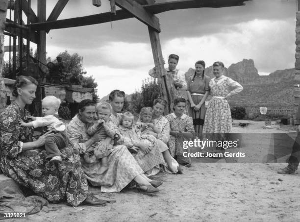 The five wives and some of the children of Richard S Jessop, one of the men arrested when police entered the tiny Mormon community of Short Creek,...