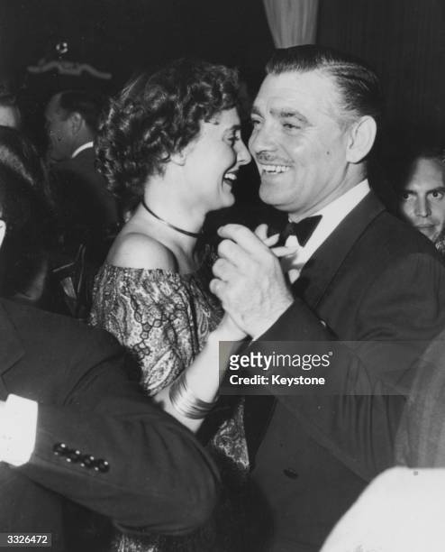 American film star Clark Gable dancing with 'Slim' Hawks at Ciro's nightclub in Hollywood. He is celebrating finishing the film 'Homecoming'.