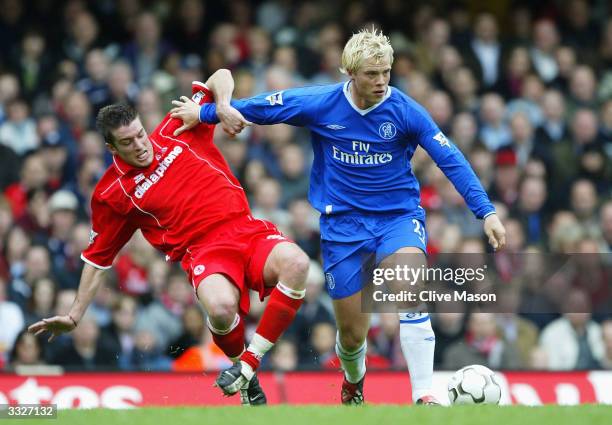 Eidur Gudjohnsen of Chelsea battles for the ball with Frank Queudrue of Middlesbrough during the FA Barclaycard Premiership match between Chelsea and...