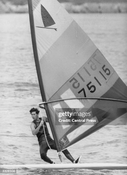 Charles, Prince of Wales windsurfing off Cowes, the Isle of Wight.