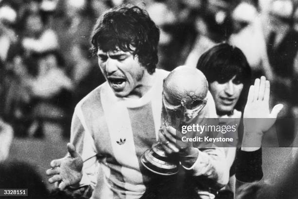 Captain of the Argentinian national football team, Daniel Passarella, with the World Cup trophy. Argentina became World Champions with a 3 - 1...