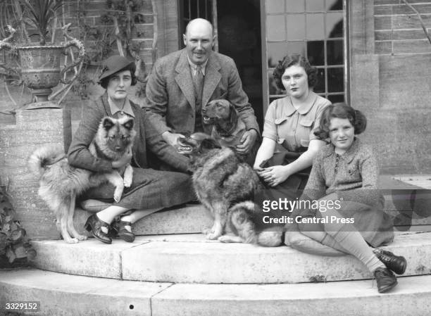 Lord and Lady Digby and their two daughters Pamela and Jaquetta with their pet dogs at their home in Minterne, Dorset.