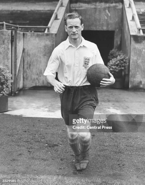 Tom Finney, captain of Preston North End, who are to play West Bromwich Albion in the 1954 FA Cup Final, wearing the England shirt he played in...