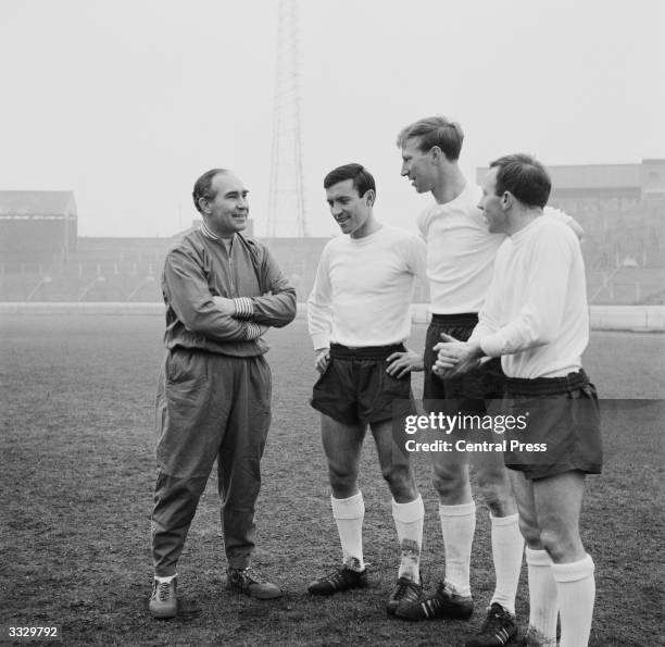 England manager Alf Ramsey chatting with three of his new team members Barry Bridges of Chelsea, Jackie Charlton of Leeds United and Nobby Stiles of...