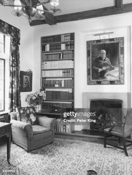 The library at Chartwell, home of former British prime minister Sir Winston Churchill. Over the fireplace is a picture of Sir Winston painted by...