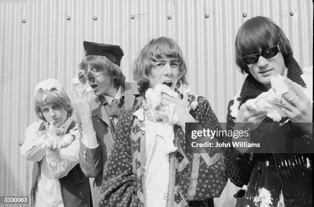 Psychedelic rock group Soft Machine tuck into into some cream cakes, they are, from left to right; Robert Wyatt, Daevid Allen, Kevin Ayers and Mike...