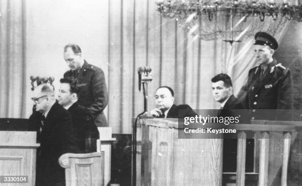 Francis Gary Powers, accused of espionage over Russia in his U2 airplane, on trial in Moscow. On the extreme left, wearing spectacles, is the defence...