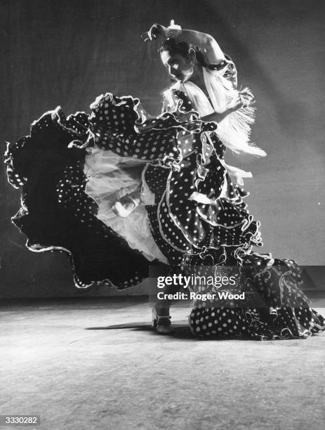 Dancer Carmen Amaya performs her interpretation of a traditional Spanish gypsy dance. Original Publication: Picture Post - 5853 - Spanish Atom - pub....