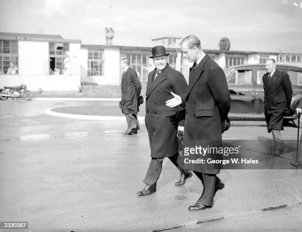 Crown Prince Olaf of Norway is met by the Duke of Edinburgh at London Airport. The Crown Prince will represent his father King Haakon at the...