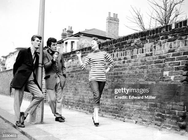 Ex-boxer Freddie Mills and radio announcer Pete Murray rehearse on a Shepherds Bush street in London for their roles as teddy boys in an edition of...