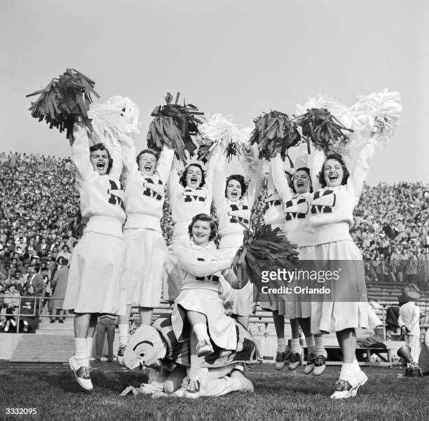 University of Maryland American football cheerleaders raising a shout for their team.