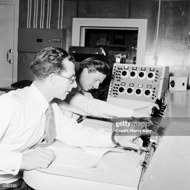 Radio producers at their control desk.