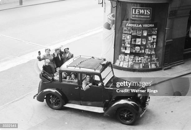 Mr Brooks, the only taxi driver living in the City of London, taking his family into town.