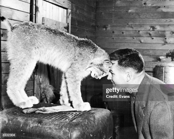 Al Oeming with his pet lynx Tonga, at home in Edmonton, Alberta.