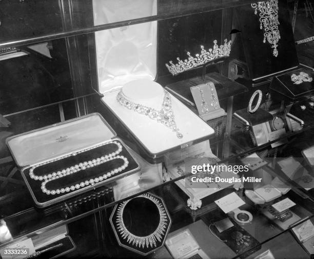 Wedding presents for Princess Elizabeth and Prince Philip on display at St James' Palace, London. The jewellery, including necklaces and a tiara, are...