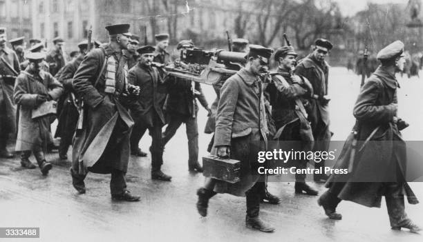 Spartacists, followers of Liebknecht's communist party, transporting machine guns through Berlin, during the Spartacist uprising in the city...