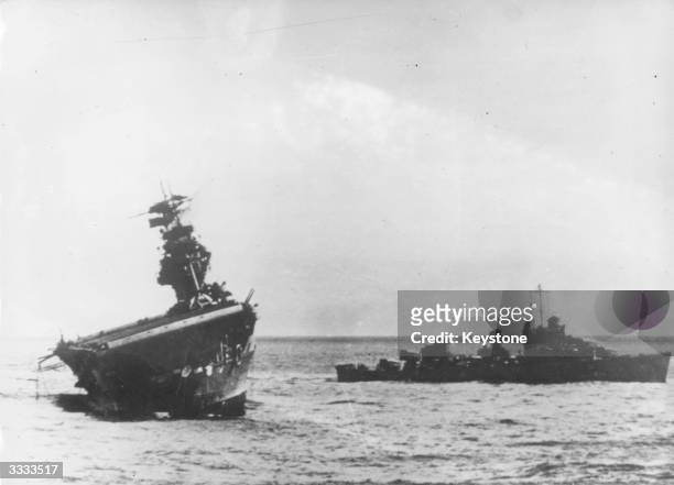 Yorktown listing heavily as she slowly sinks having been attacked by the Japanese near the Midway Islands.
