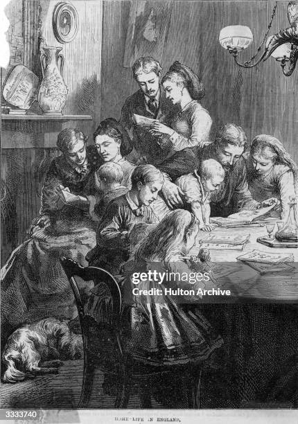 Large family all reading, some members gathered round a table and at the fireplace a woman reads to two children. Original Publication: Illustrated...