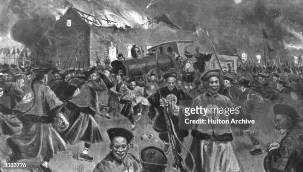 Burning station and derailed train on the Manchurian railway with Chinese nationalists celebrating their action during the Boxer Rebellion. Original...