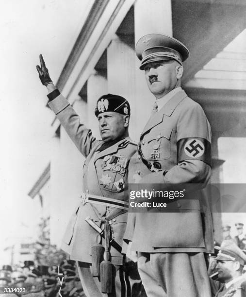 German dictator Adolf Hitler and Italian dictator Benito Mussolini 'Il Duce', viewing columns of German troops in Munich during Mussolini's visit to...