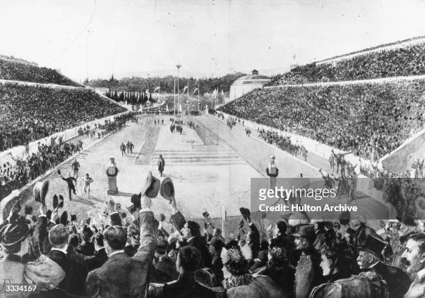 Greek shepherd Spyridon Louis , winner of the 40 km marathon is joined by King George I of Greece on the last lap of his run at the Athens Olympics.