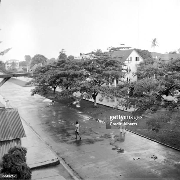 Broad Street is the main street in Monrovia, capital of Liberia, a wide thoroughfare lined with trees.