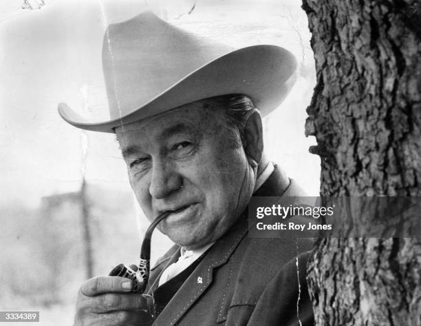 American country singer and film actor Tex Ritter , known for his roles as a singing cowboy.