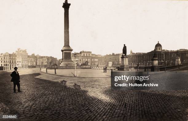 The National Gallery , Nelson's Column and the statue of British soldier Sir Henry Havelock at Trafalgar Square.