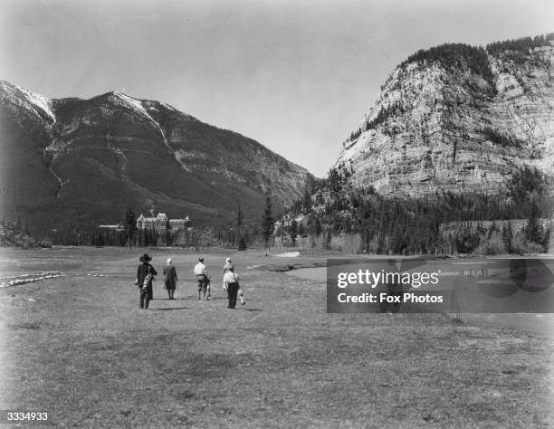 Golfers on the 14th Green of the Banff Springs golf course.