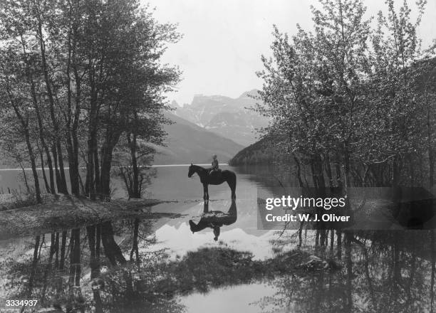 Rider on horseback in Waterton Lakes National Park, British Columbia.