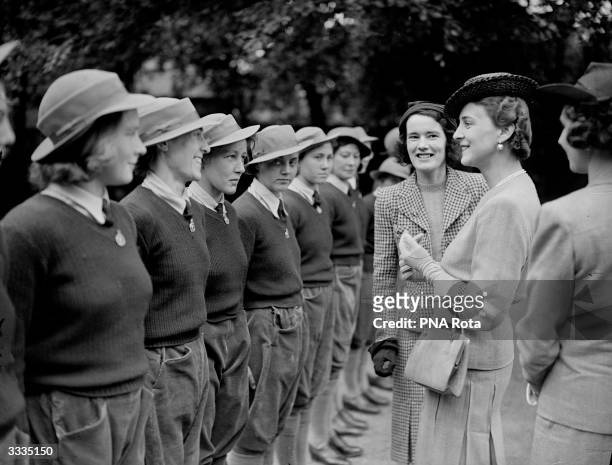 The Duchess of Kent chats to Land Army girls in Slough during the opening of a new YWCA Land Army Hostel.
