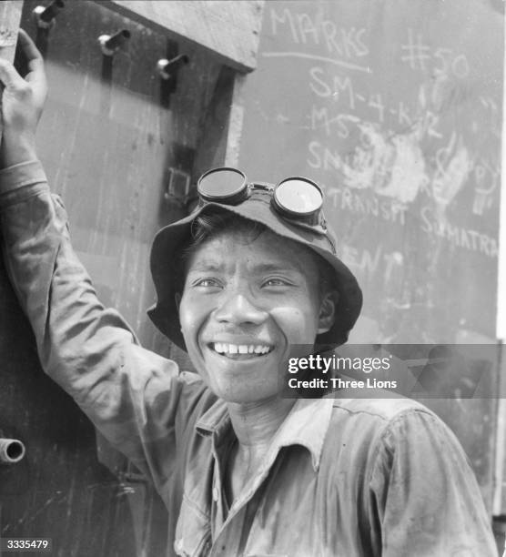 An Indonesian oil worker smiles for the camera.