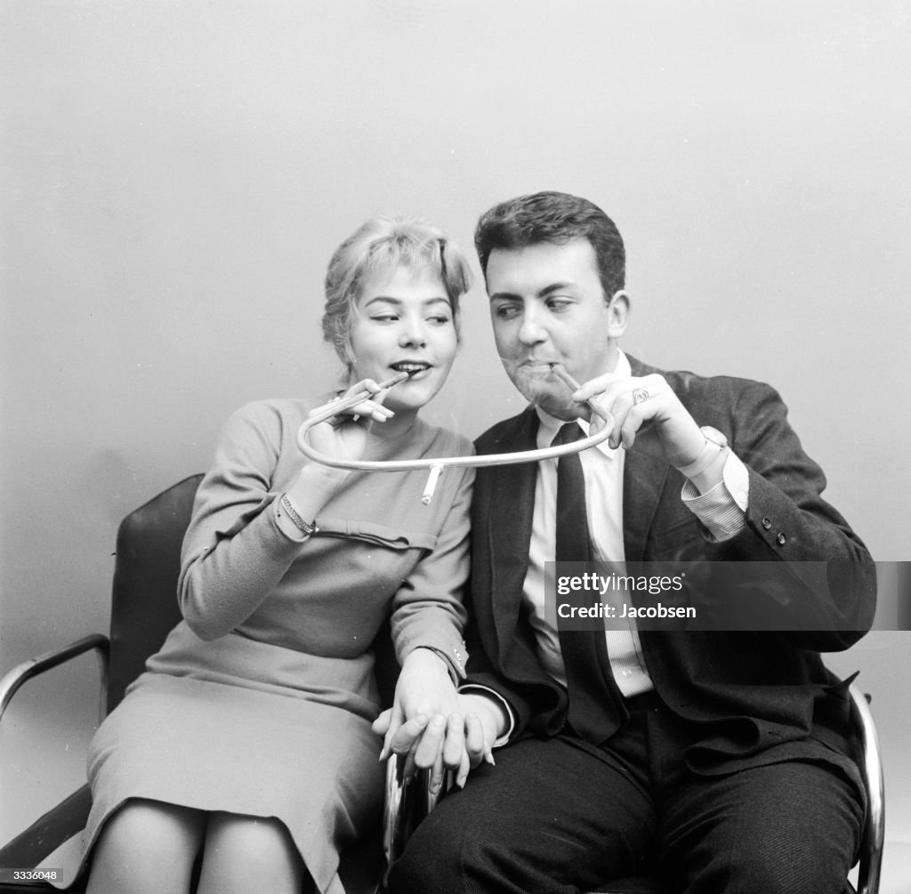lovers cigarette holder A couple share a cigarette holder made for two. From a series of... News Photo lovers cigarette holder A couple share a cigarette holder made for two. From a series of... News Photo