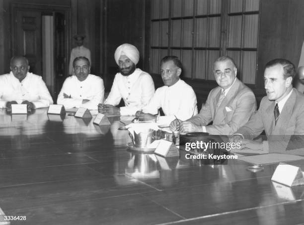 Lord Mountbatten, Viceroy of India , presenting representatives of India with Britain's plan for the partition of the country ; the Jamasahib of...