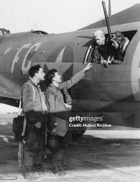 American pilots with their B-17 Flying Fortress bomber.