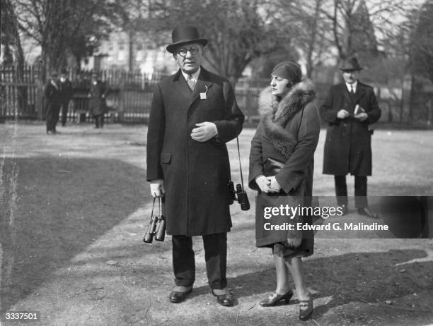 Mrs Herty owner of 'Reigh Court' with her husband at Lingfield Park.