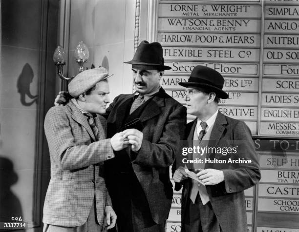 Scene from the Gainsborough comedy 'Convict 99', with British comic actor Will Hay on the right. The film was directed by Marcel Varnel.