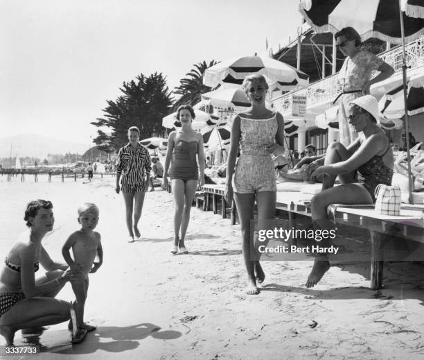 Group of women on the beach at Juan-les-Pins on the Cote d'Azur, France. Original Publication: Picture Post - 7850 -The Secret Of Five Girls On A...