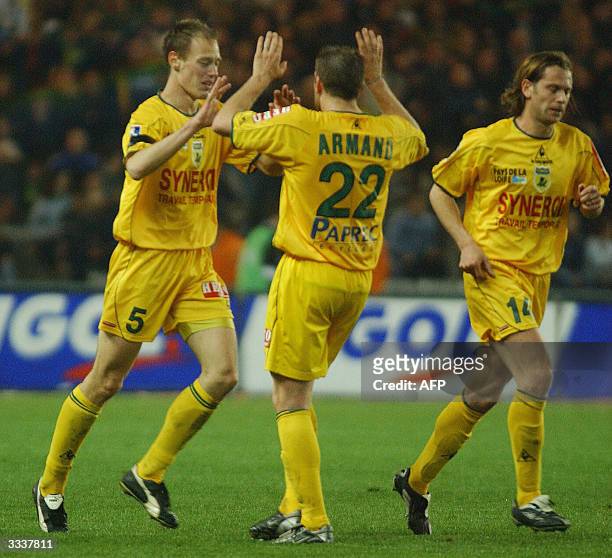 Nantes' defender Nicolas Gillet is congratulated by his teammate Sylvain Armand , after scoring a goal during their French L1 football match, 10...