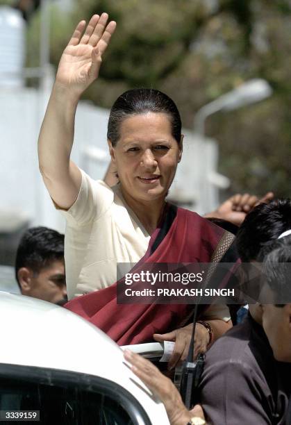 Indian Oposition Leader and Congress Party President Sonia Gandhi waves to supporters of Muslim leader Rashid Alvi at her residence in New Delhi, 11...