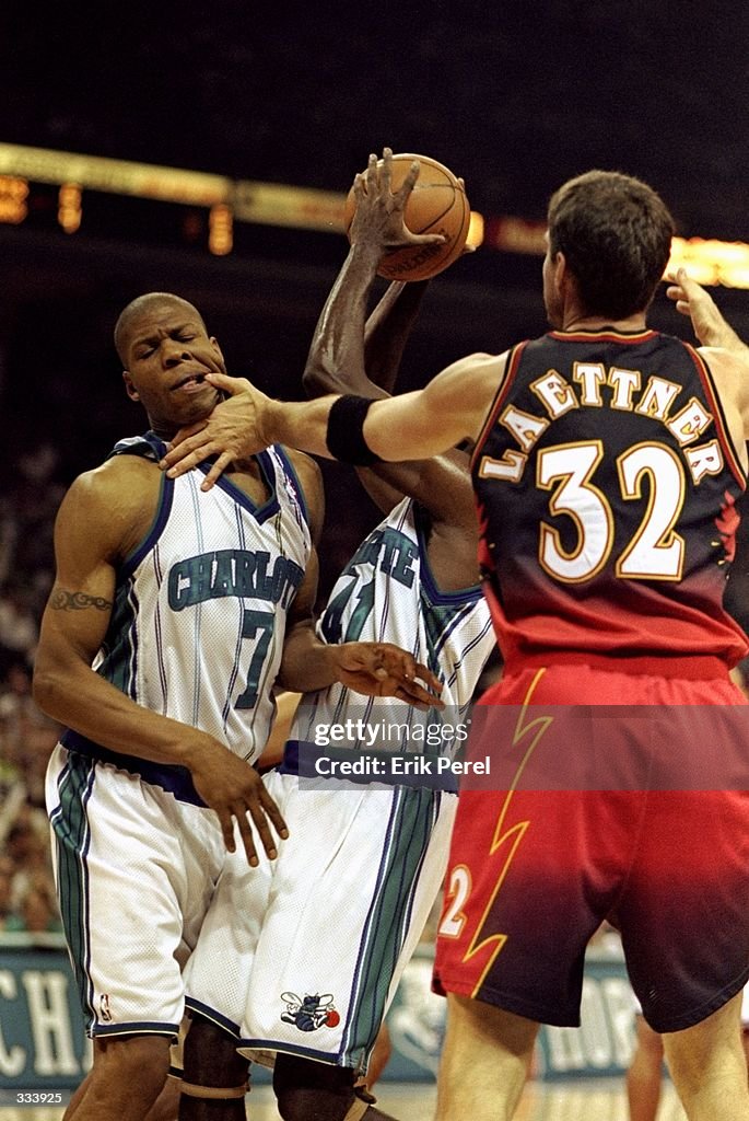 J R Reid J.R. Reid of the Charlotte Hornets bites the finger of Christian ...