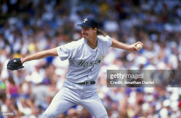 Pitcher Randy Johnson the Houston Astos throws during the game against the Chicago Cubs at Wrigley Field in Chicago, Illinois. The Astros defeated...
