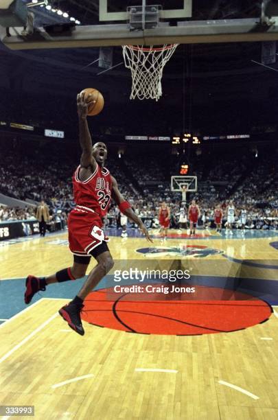 Michael Jordan of the Chicago Bulls jumps to make a lay-up during the East Conference Semifinals against the Charlotte Hornets at Charlotte Coliseum...