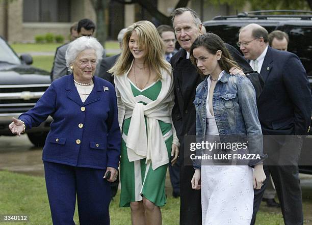 Former US President George Bush and Former First Lady Barbara Bush walk into an Easter Sunday service with their grand daughters Barbara and Jenna...